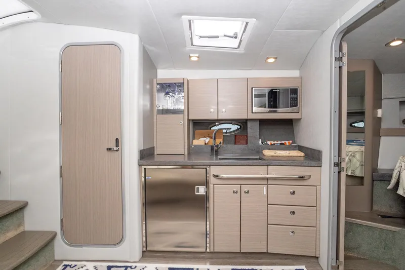Rum Punch It Yacht Photos Pics 2018 Formula 37 Performance Cruiser interior kitchen with modern appliances and sleek cabinetry.