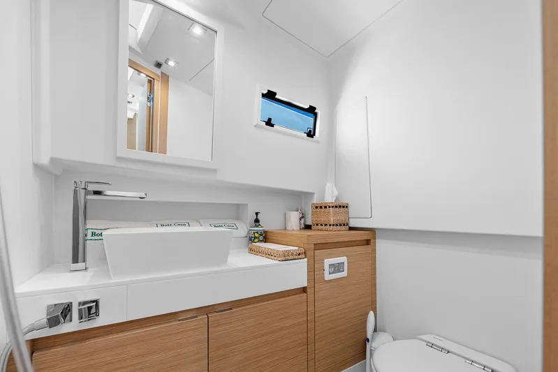 Bote Coco Yacht Photos Pics Modern bathroom interior on 2023 Pardo Yachts P38, featuring sleek design and wooden cabinetry.