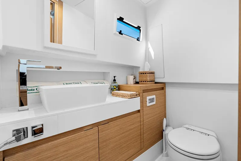 Bote Coco Yacht Photos Pics Modern bathroom interior on 2023 Pardo Yachts P38, featuring sleek design and wooden cabinetry.