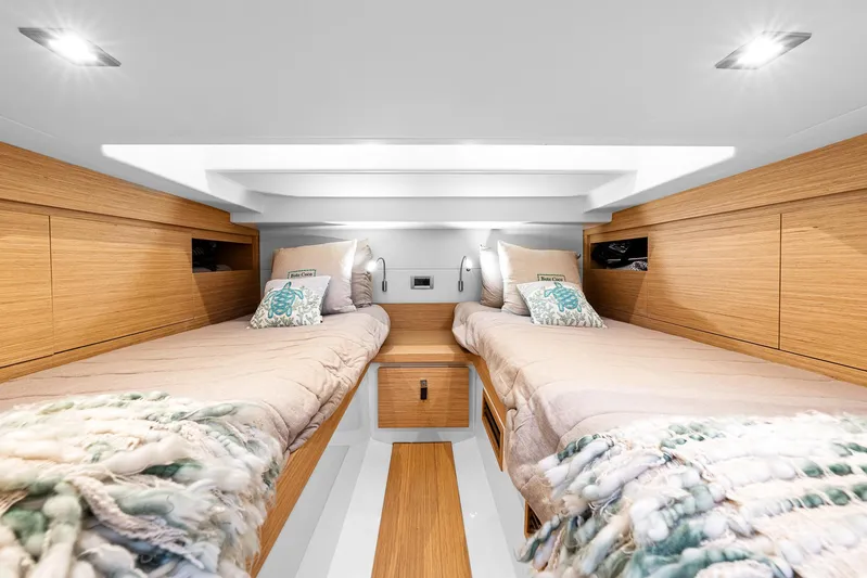 Bote Coco Yacht Photos Pics Luxurious 2023 Pardo Yachts P38 cabin interior with twin beds and modern wood finish.