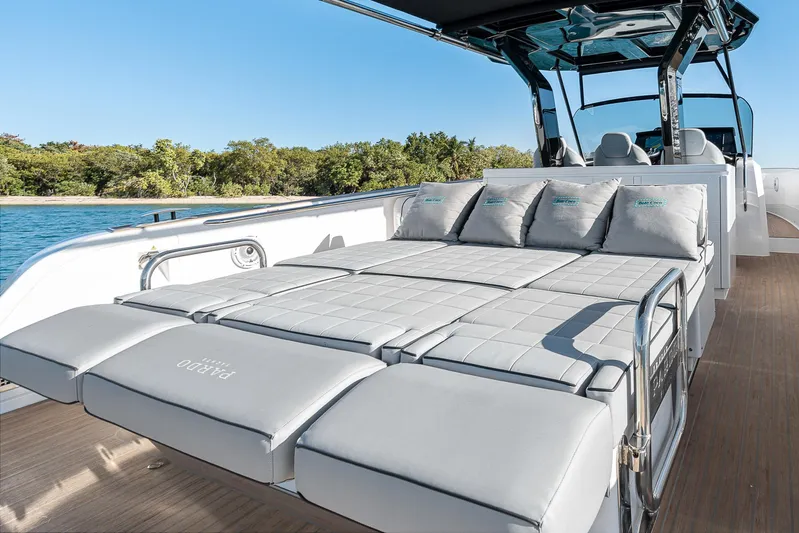 Bote Coco Yacht Photos Pics 2023 Pardo Yachts P38 luxury yacht with sunbed, sleek design, and scenic water view.