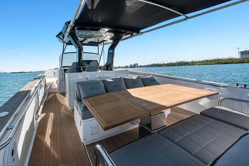 Bote Coco Yacht Photos Pics 2023 Pardo Yachts P38 luxury yacht interior with seating and table on open water.