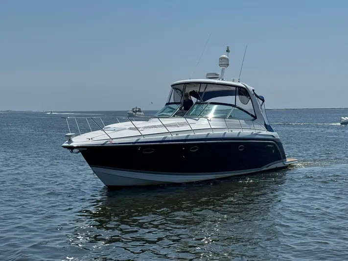  Yacht Photos Pics 2008 Formula 40 PC boat cruising on calm water under clear blue sky.