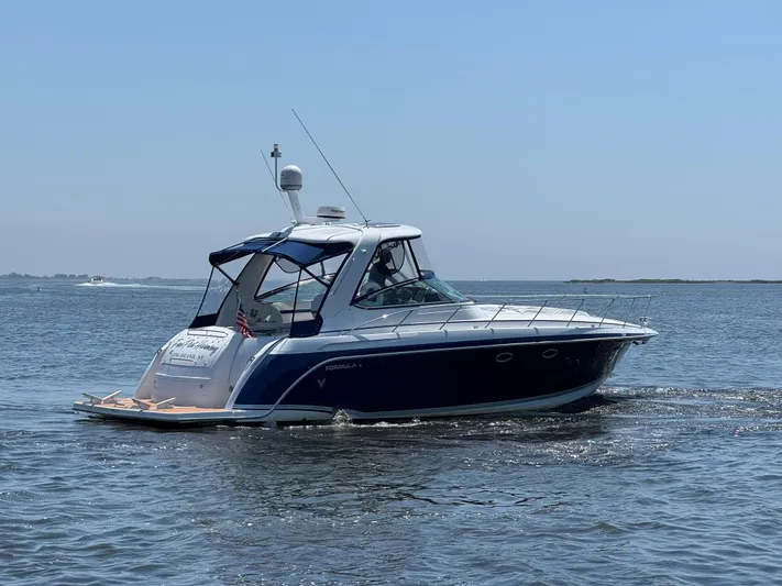  Yacht Photos Pics 2008 Formula 40 PC yacht cruising on open water under clear skies.