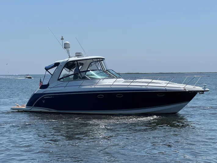  Yacht Photos Pics 2008 Formula 40 PC yacht cruising on open water under clear blue sky.