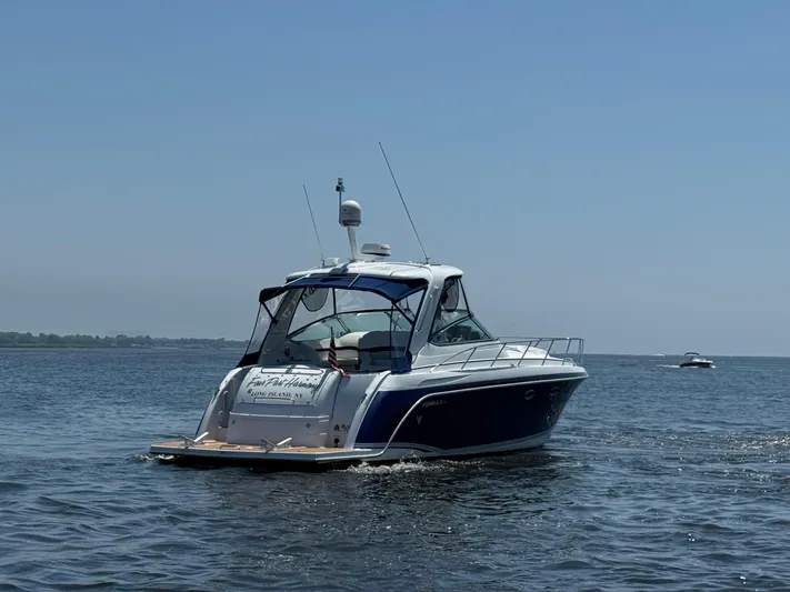  Yacht Photos Pics 2008 Formula 40 PC yacht cruising on open water under clear blue sky.