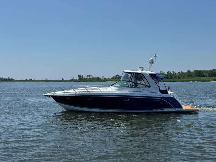  Yacht Photos Pics 2008 Formula 40 PC yacht cruising on a calm lake under clear blue skies.