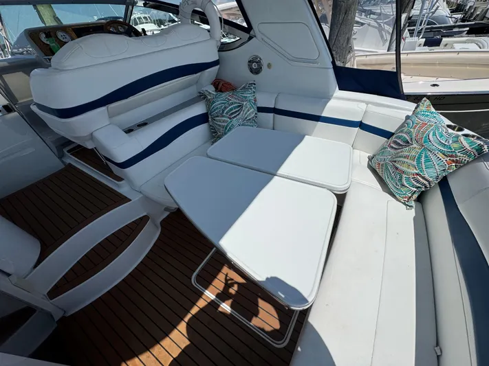  Yacht Photos Pics 2008 Formula 40 PC yacht interior with white seating and colorful pillows.