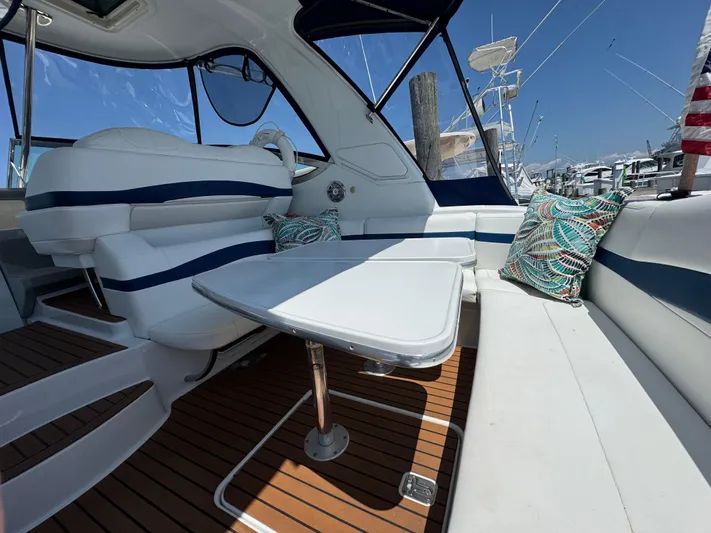  Yacht Photos Pics Luxurious 2008 Formula 40 PC yacht interior with plush seating and elegant table.