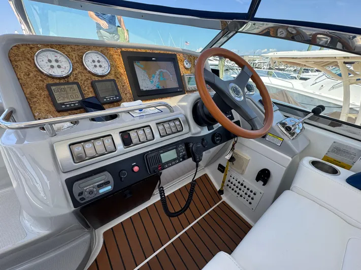  Yacht Photos Pics Helm of 2008 Formula 40 PC boat with navigation instruments and wooden steering wheel.