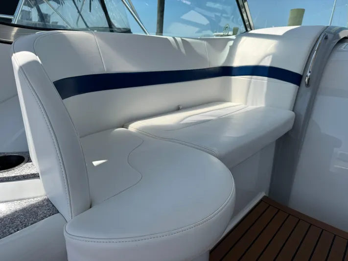  Yacht Photos Pics Luxurious white seating on a 2008 Formula 40 PC yacht, featuring sleek design and blue accents.