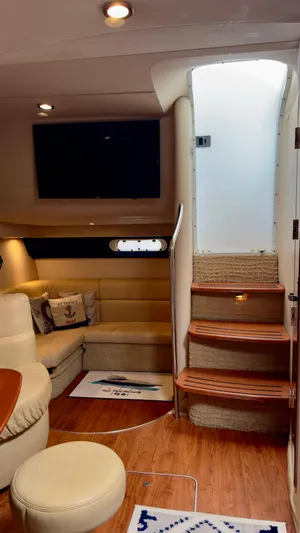  Yacht Photos Pics Interior of 2008 Formula 40 PC yacht with cozy seating and wooden stairs.