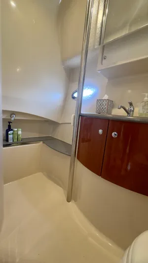  Yacht Photos Pics 2008 Formula 40 PC yacht bathroom with sink, wooden cabinets, and toiletries.