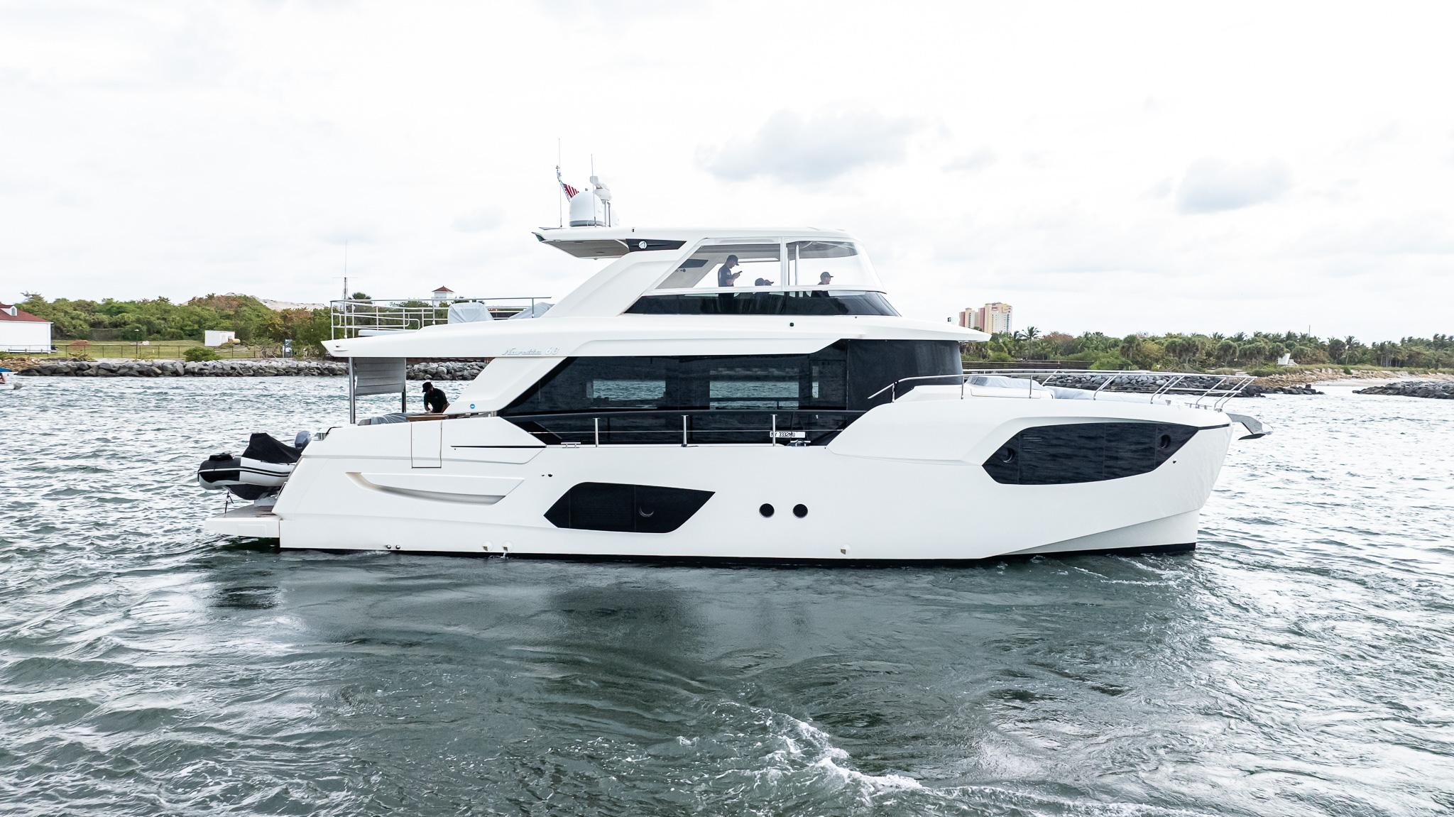 2024 Absolute 68 NAVETTA yacht cruising on open water, showcasing sleek design and modern features.