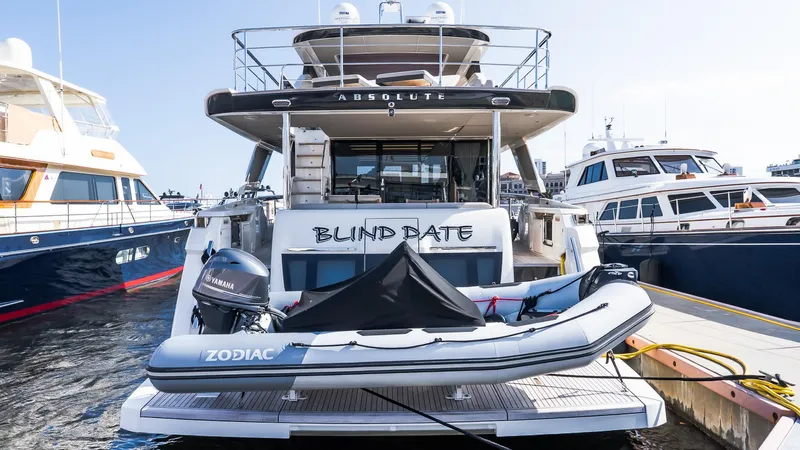 Available Now Yacht Photos Pics 2024 Absolute 68 NAVETTA yacht docked with Zodiac tender at the stern.