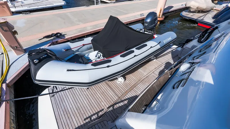 Available Now Yacht Photos Pics Inflatable boat on Absolute 68 NAVETTA yacht deck, 2024 model, docked at marina.