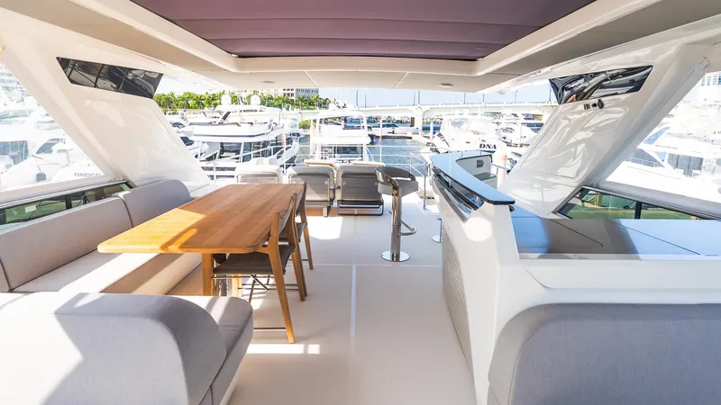 Available Now Yacht Photos Pics Luxurious interior of 2024 Absolute 68 NAVETTA yacht with elegant seating and dining area.