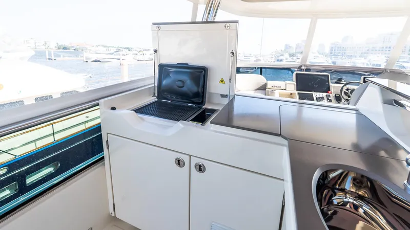 Available Now Yacht Photos Pics 2024 Absolute 68 NAVETTA yacht interior with modern navigation equipment and sleek design.