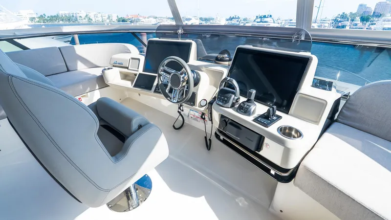 Available Now Yacht Photos Pics 2024 Absolute 68 NAVETTA yacht helm with modern controls and seating.