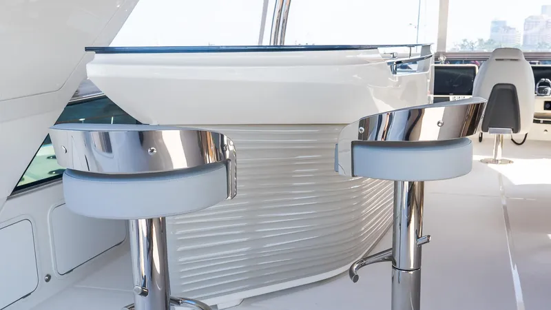 Available Now Yacht Photos Pics Luxurious interior of 2024 Absolute 68 NAVETTA yacht with modern bar stools.