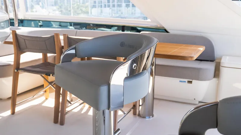 Available Now Yacht Photos Pics Luxurious interior of 2024 Absolute 68 NAVETTA yacht with modern seating and dining area.