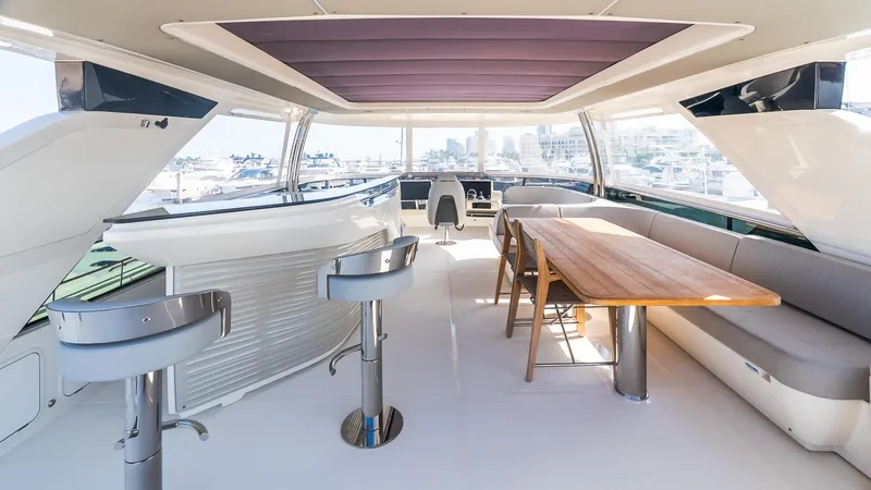 Available Now Yacht Photos Pics Luxurious interior of 2024 Absolute 68 NAVETTA yacht with modern seating and dining area.