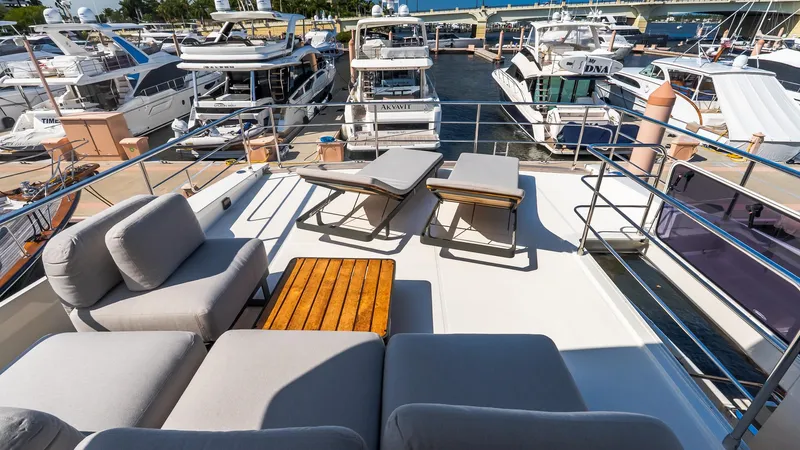 Available Now Yacht Photos Pics Luxurious 2024 Absolute 68 NAVETTA yacht deck with comfortable seating and sun loungers.