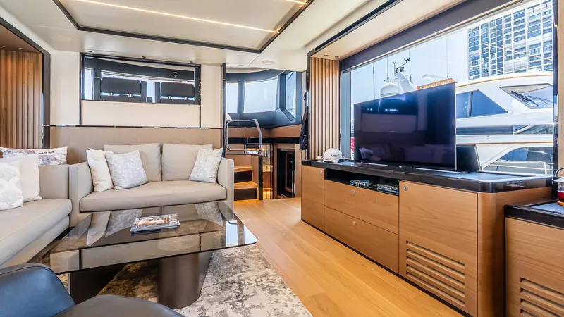 Available Now Yacht Photos Pics Luxurious interior of 2024 Absolute 68 NAVETTA yacht with modern furnishings and large TV.