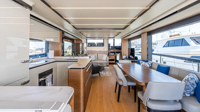 Available Now Yacht Photos Pics Luxurious interior of 2024 Absolute 68 NAVETTA yacht with modern kitchen and dining area.