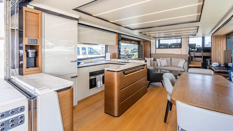 Available Now Yacht Photos Pics Luxurious interior of 2024 Absolute 68 NAVETTA yacht with modern kitchen and dining area.
