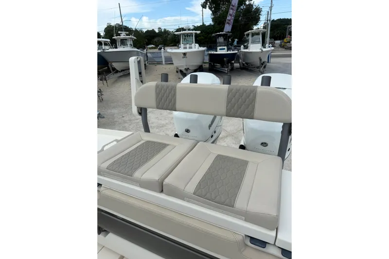 Yacht Photos Pics 2023 Solace 32 CS boat seating with quilted upholstery, showcasing luxury and comfort.