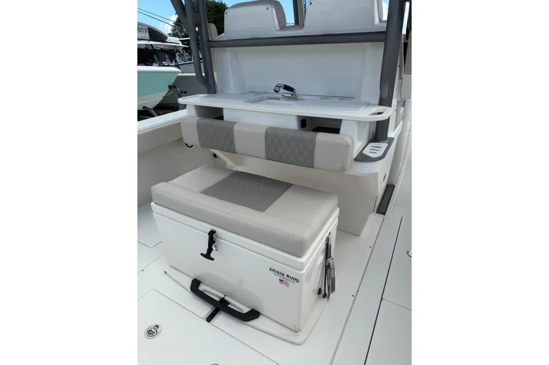  Yacht Photos Pics 2023 Solace 32 CS boat interior with cushioned seating and storage.