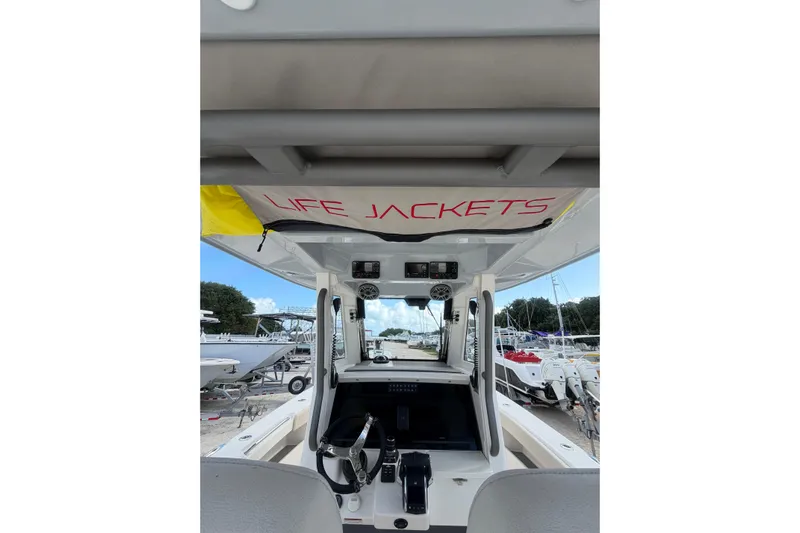  Yacht Photos Pics 2023 Solace 32 CS boat interior with life jackets storage, docked at marina.