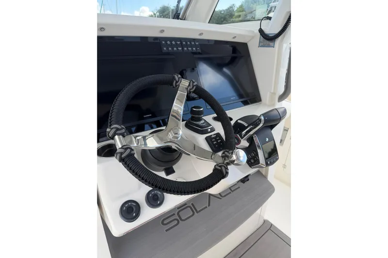  Yacht Photos Pics Helm of 2023 Solace 32 CS boat with modern controls and steering wheel.