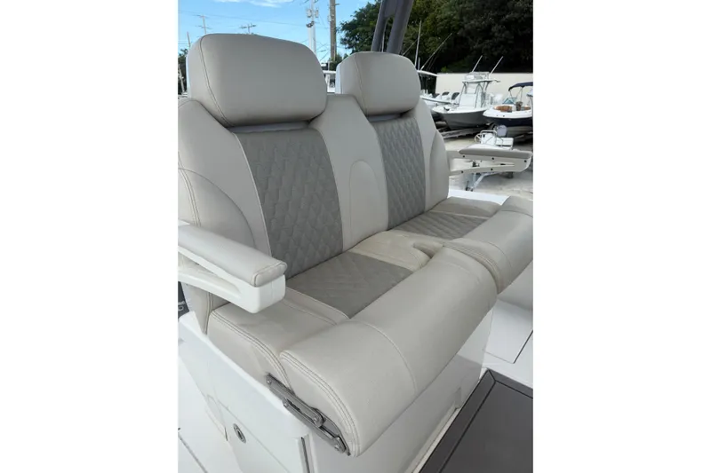 Yacht Photos Pics 2023 Solace 32 CS boat seating with luxurious gray and beige upholstery.
