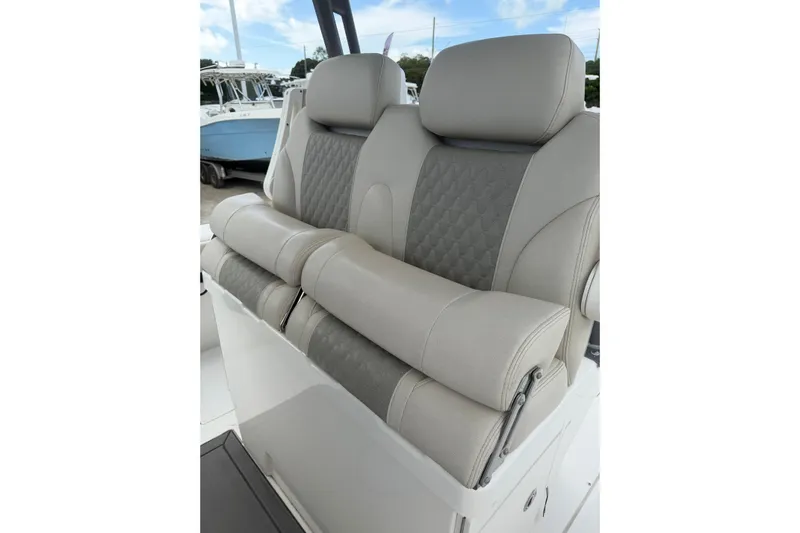  Yacht Photos Pics Luxurious seating on 2023 Solace 32 CS boat, featuring elegant design and comfort.