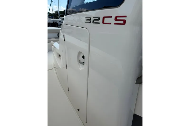  Yacht Photos Pics 2023 Solace 32 CS boat side view with model name displayed.