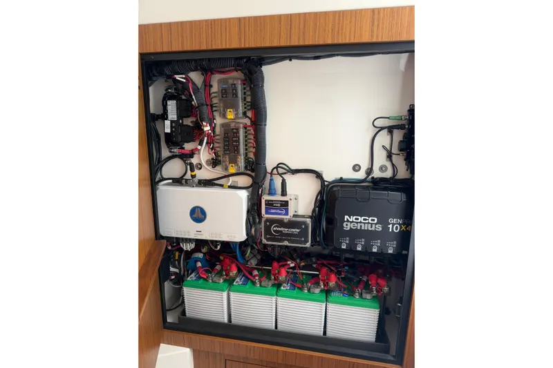  Yacht Photos Pics Electrical panel of 2023 Solace 32 CS boat with NOCO Genius charger and batteries.