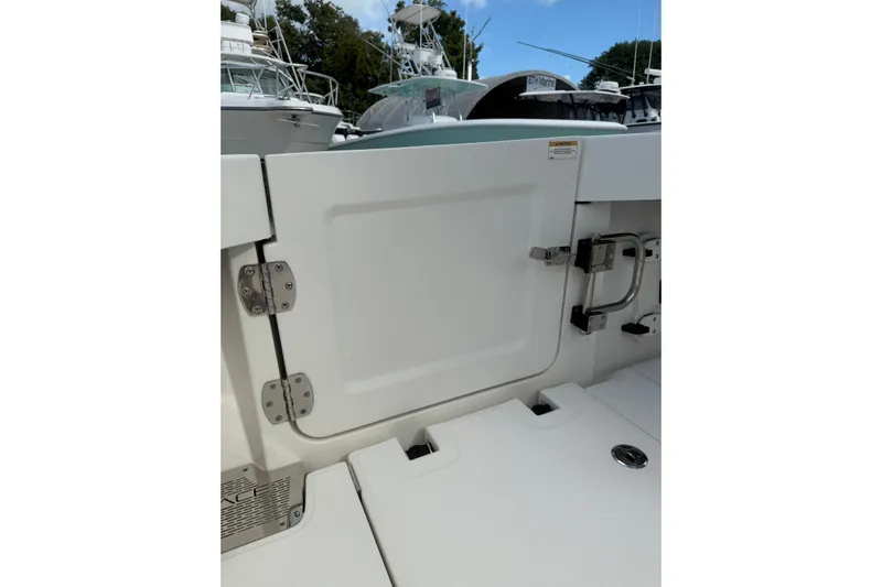  Yacht Photos Pics 2023 Solace 32 CS boat door with stainless steel hinges and latch.