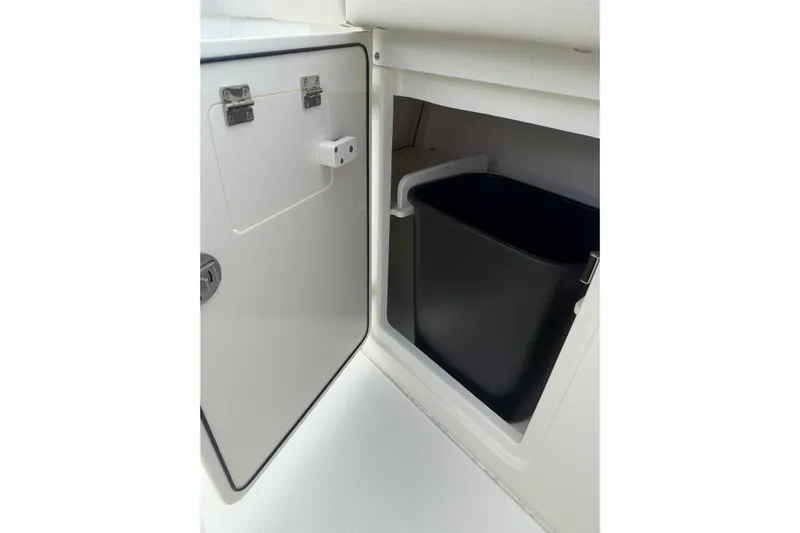  Yacht Photos Pics Open storage compartment with black bin in 2023 Solace 32 CS boat.