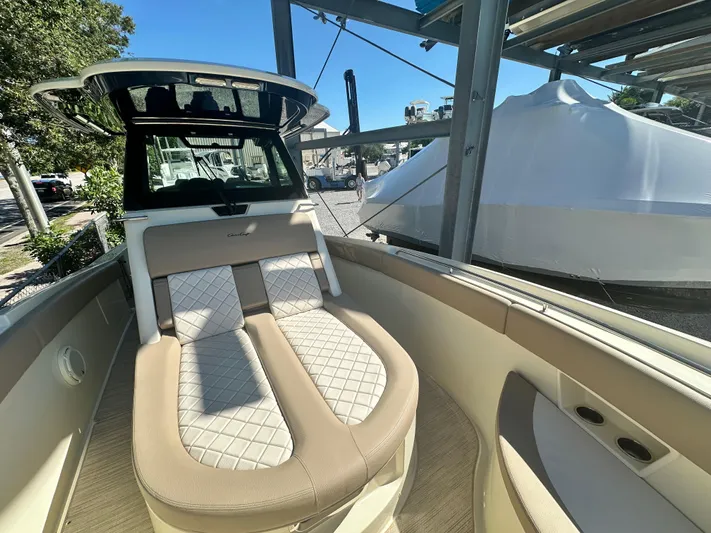  Yacht Photos Pics 2024 Chris-Craft Catalina 30 boat interior with cushioned seating.