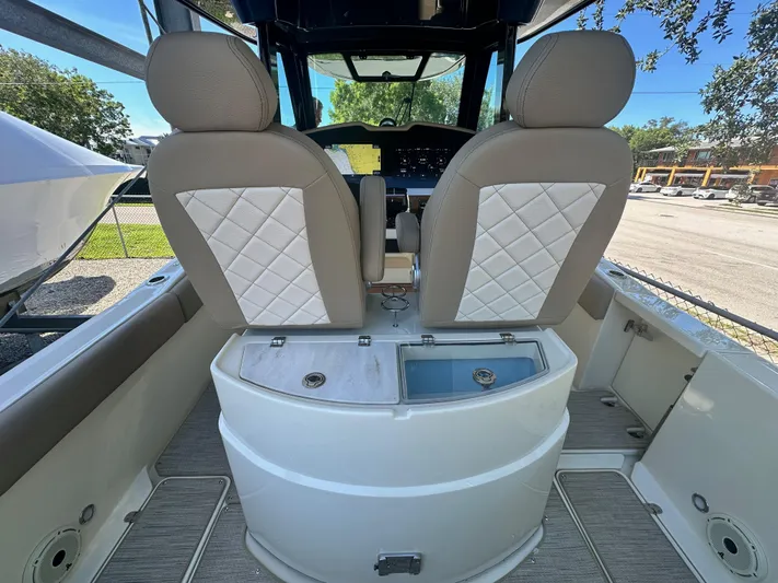  Yacht Photos Pics 2024 Chris-Craft Catalina 30 boat interior with dual seats and control panel.