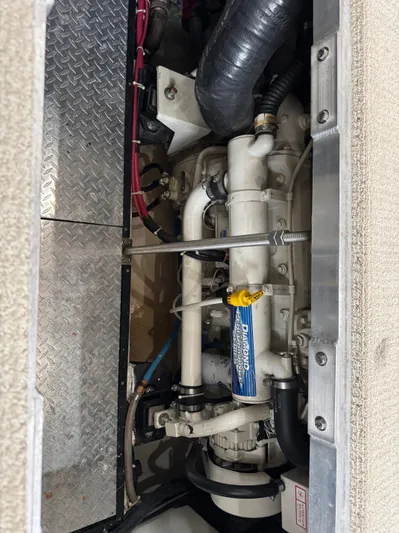  Yacht Photos Pics Engine compartment of a 2001 Carver 444 Cockpit Motor Yacht, showcasing mechanical components.