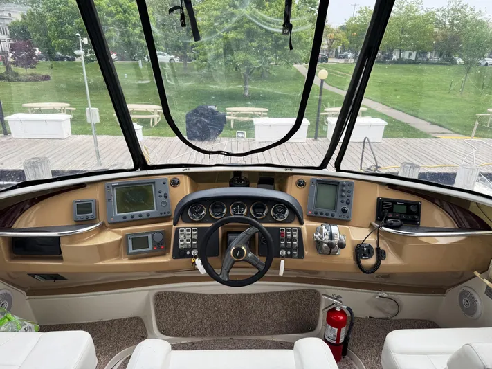  Yacht Photos Pics 2001 Carver 444 Cockpit Motor Yacht helm with navigation instruments and steering wheel.