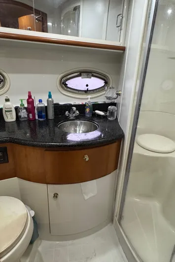  Yacht Photos Pics 2001 Carver 444 Cockpit Motor Yacht bathroom with sink, toiletries, and shower.