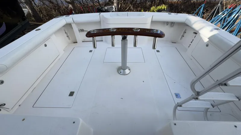 A-plus Yacht Photos Pics 2003 Cabo 35 Flybridge Sportfisher cockpit with fishing rod holders and ladder.