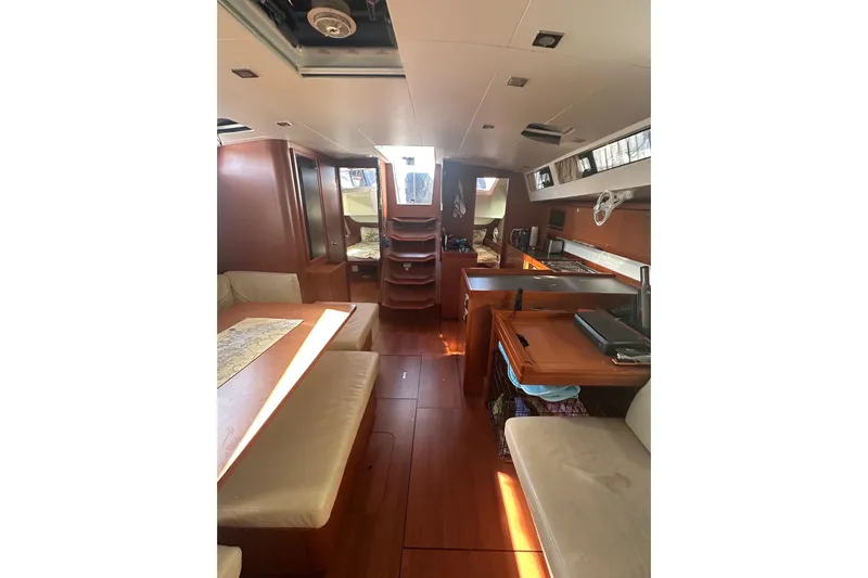  Yacht Photos Pics Interior of 2014 Beneteau Oceanis 48 yacht, featuring spacious seating and modern kitchen area.