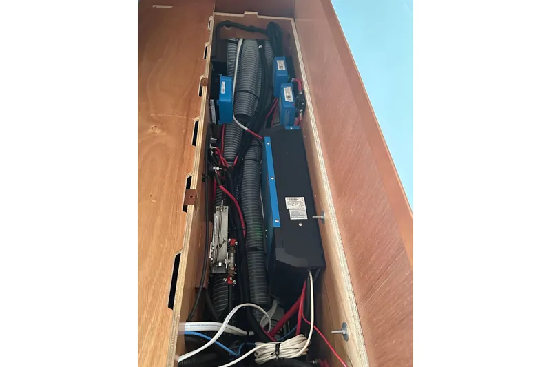  Yacht Photos Pics Electrical system inside a 2014 Beneteau Oceanis 48 yacht, featuring wiring and components.