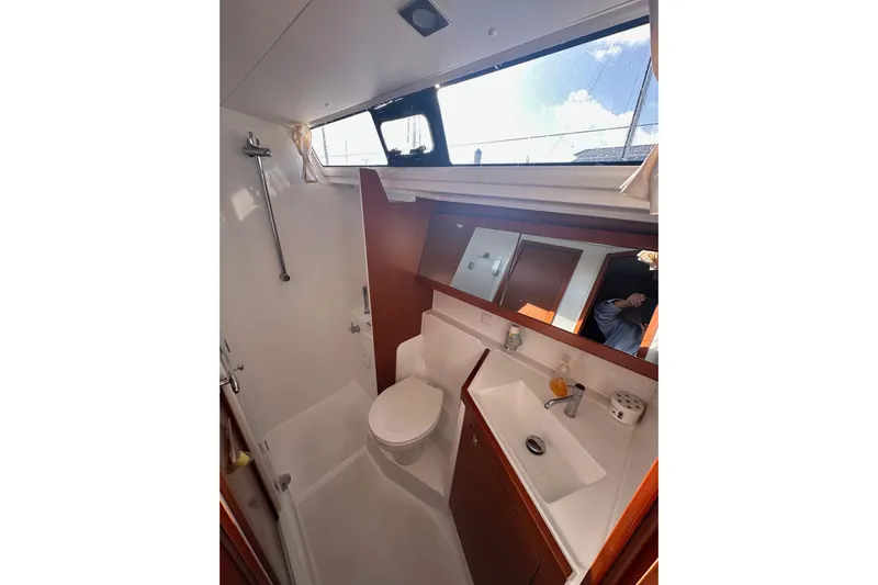 Yacht Photos Pics Bathroom interior of 2014 Beneteau Oceanis 48 yacht with shower and sink.