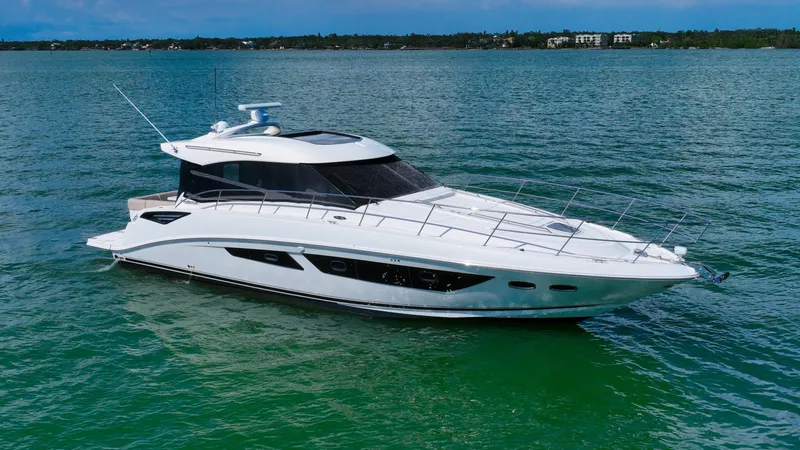 Just In Time Yacht Photos Pics 2016 Sea Ray 470 Sundancer yacht on calm water, showcasing sleek design and luxury features.